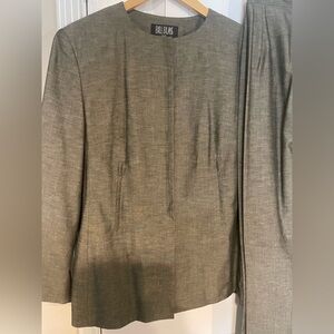 Bill Blass Woman Power Suit. Featuring hidden buttons and pockets w/zipper.